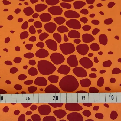 Jersey Stoff orange Drachenhaut -  Drache Kokosnuss